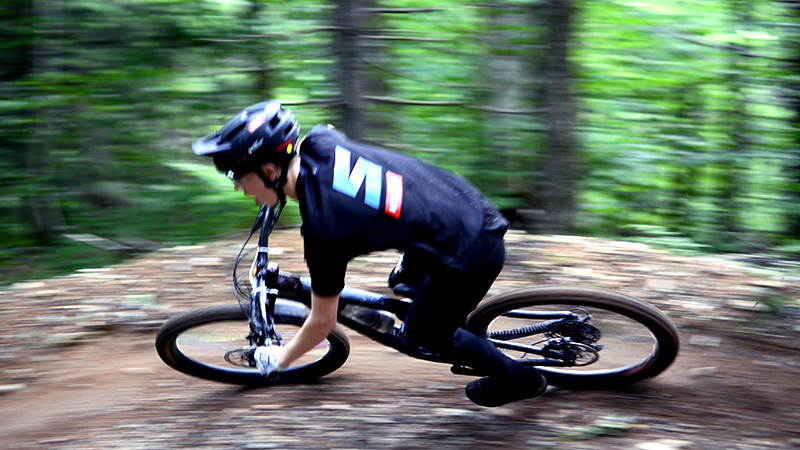 A mountain biker turns around a corner